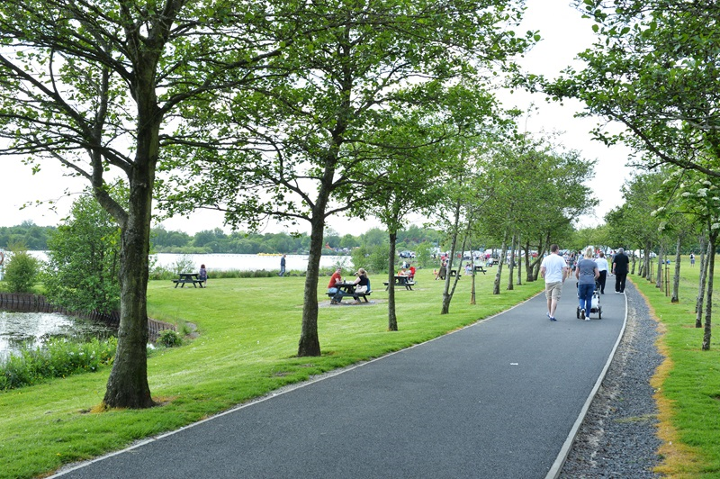 A photo of people walking and picnicing at Drumpellier Country Park